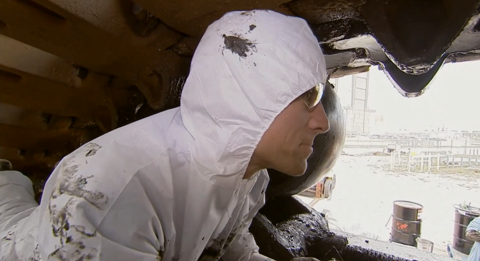 Mike Rowe shows what it is like to lubricate the Crawler on an episode of Dirty Jobs Image